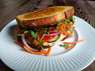 veggie sandwich on white plate