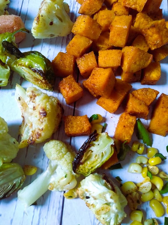 roasted sweet potatoes, brussel sprouts, cauliflower, and corn