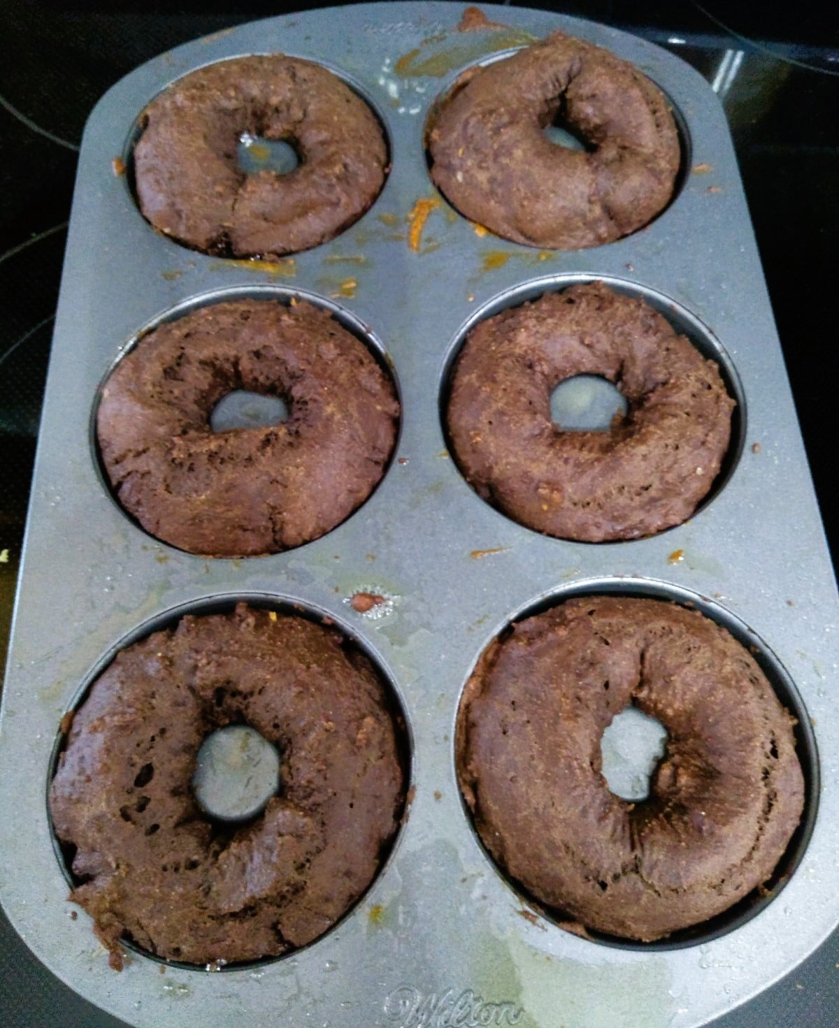 fresh out of the oven chocolate doughnuts