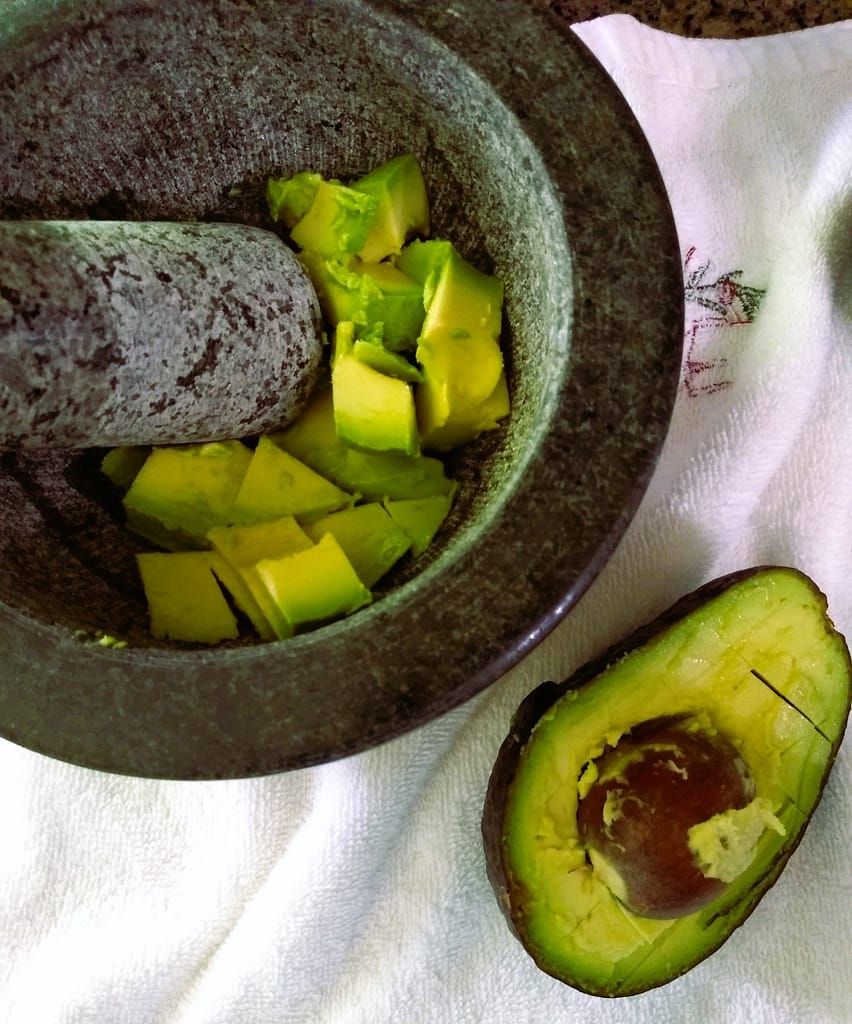 diced avocado in mortar and pestle